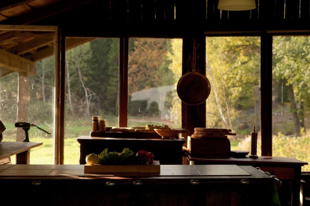 Summer kitchen interior with outdoor view