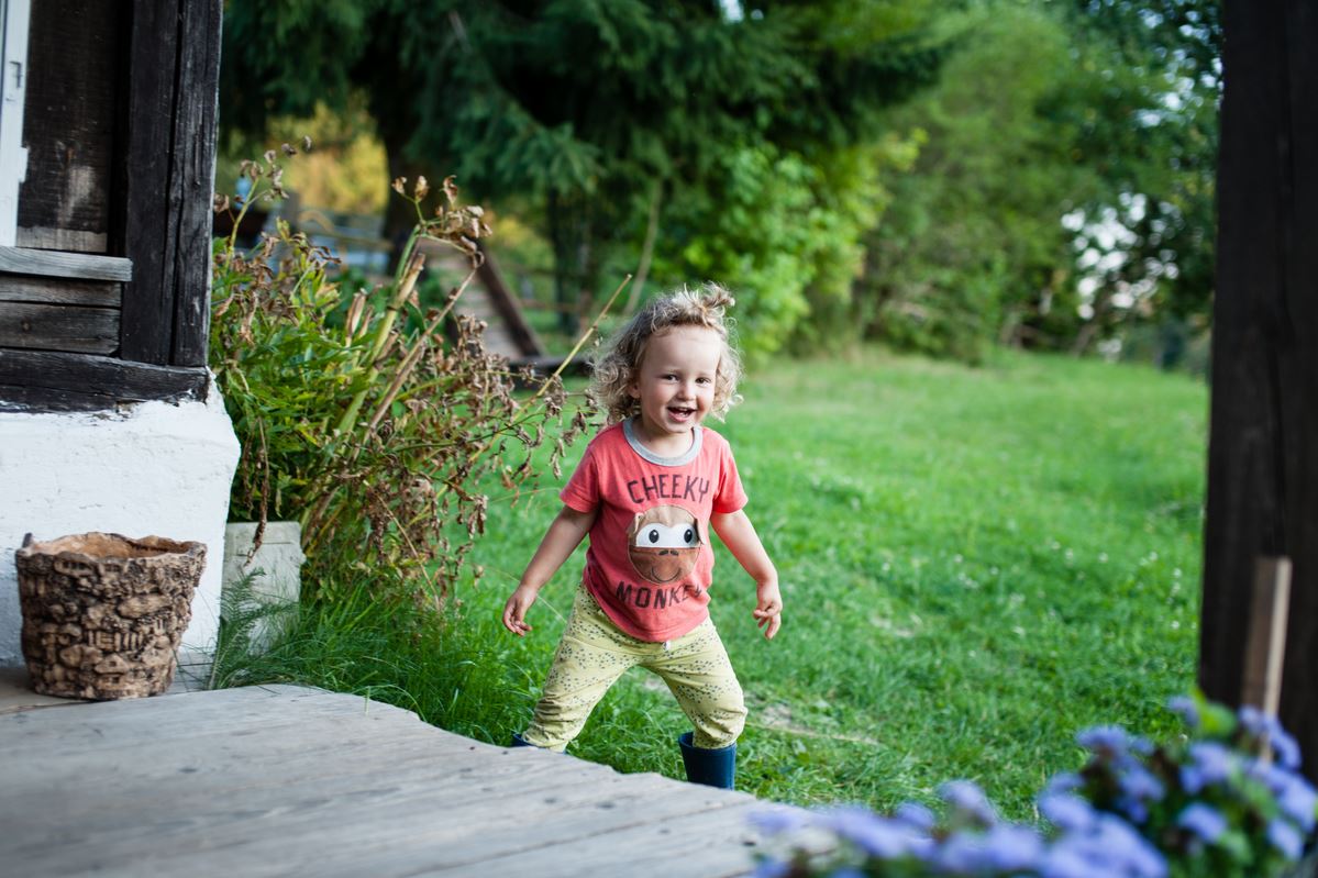 Child playing outside in summer
